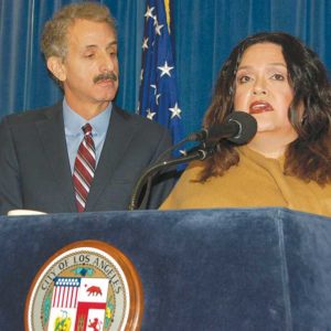 Mariana Marroquin, program manager for the Los Angeles LGBT Center’s Anti-Violence Project, outlined services for LGBT victims of hate crimes and was joined by Los Angeles City Mike Feuer, who called for more reporting of incidents. (photo by Edwin Folven)