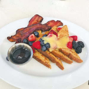 The French toast at Ocean Prime comes with candied bacon to add a savory, salty zing to the sweet dish. (photo by Jill Weinlein)
